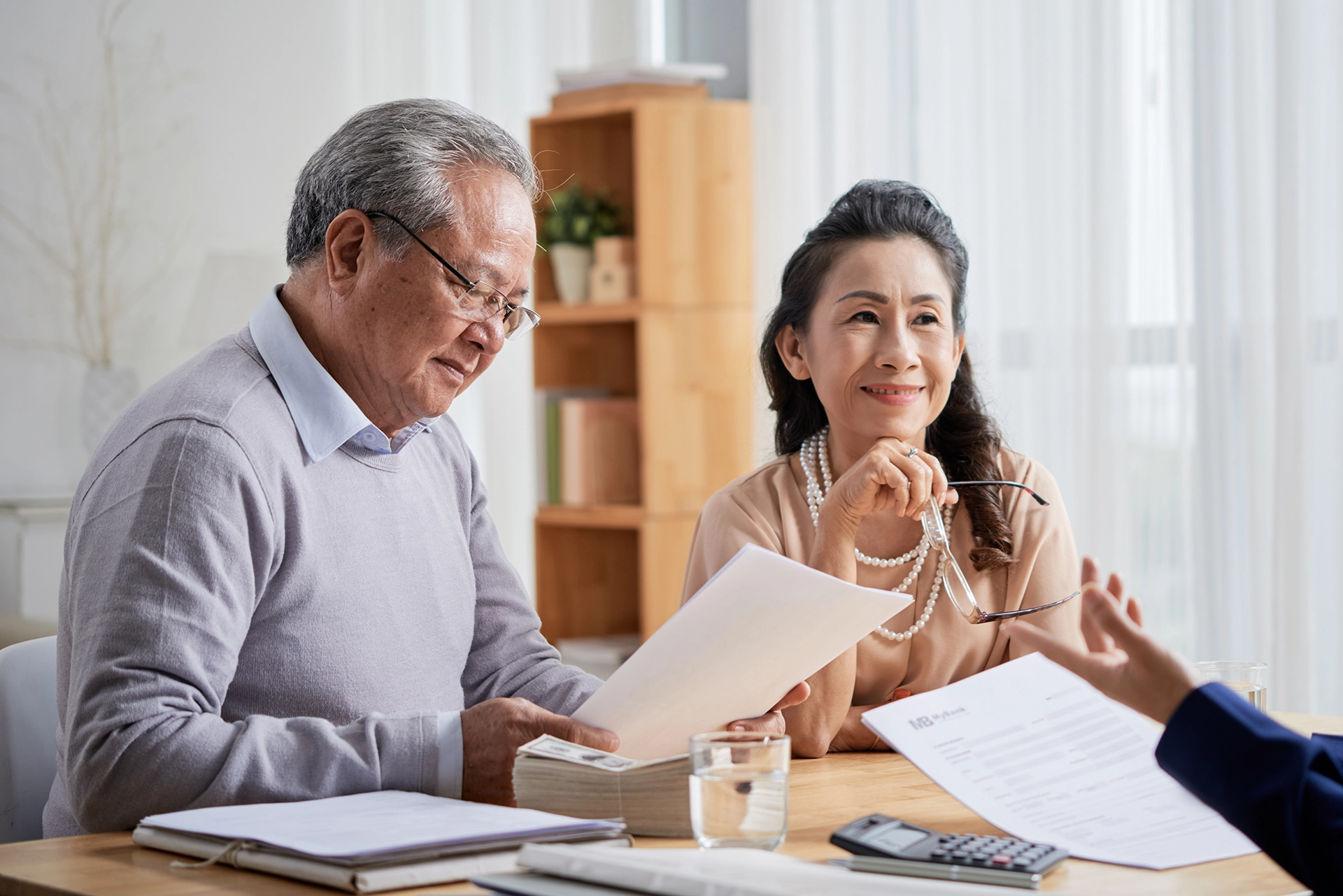 Older couple meeting with an attorney to review trust documents for asset protection and legacy planning