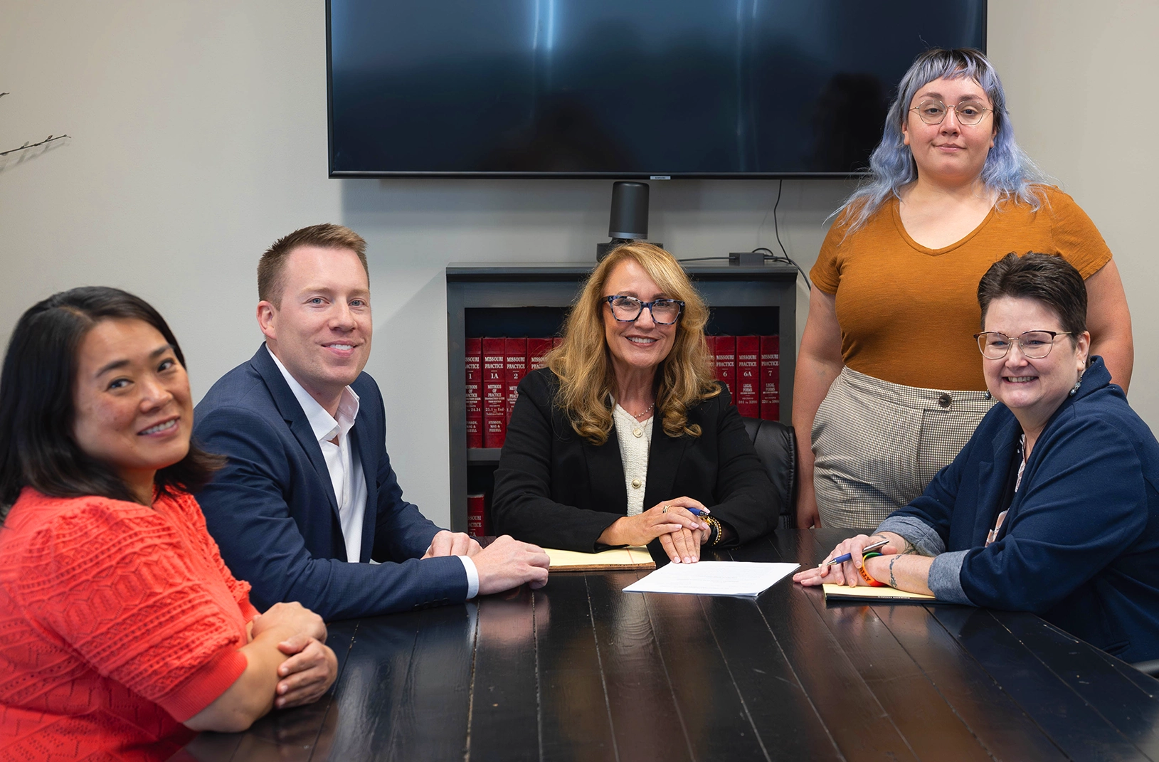 Janssen Estate Probate & Elder Law team sitting together in a conference room providing estate and elder law guidance