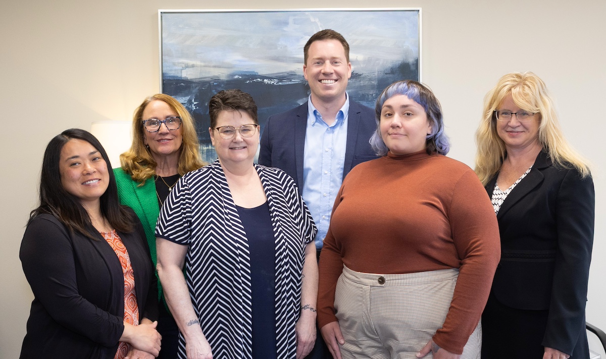 Janssen Estate Probate & Elder Law team sitting together in a conference room providing estate and elder law guidance